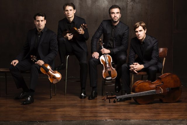 Photo of Modigliani Quartet members with instruments