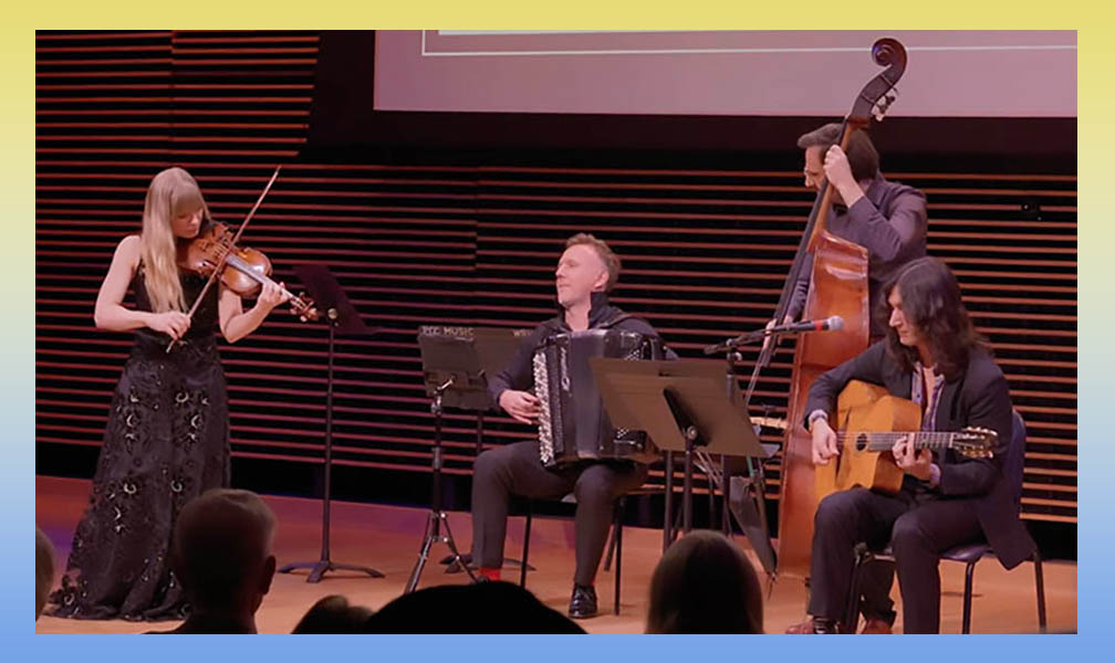 four musicians playing on a stage