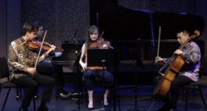 Photo of musicians playing on stage at Lani Hall.