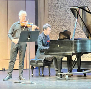 Photo of Martin Chalifour and and Steven Vanhauwaert playing on stage at Lani Hall.